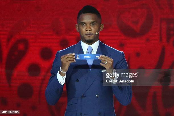 Samuel Eto'o of Antalyaspor shows the name of Guinea during the preliminary draw of the 2018 World Cup qualifiers at the Konstantin Palace in Saint...