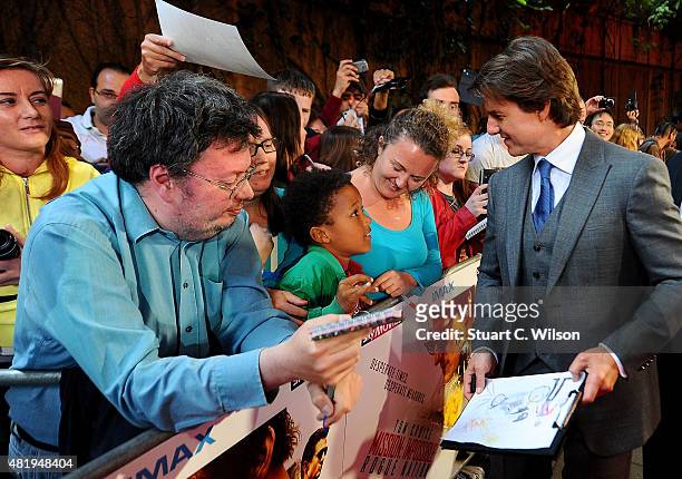 Tom Cruise with fans as he attends the UK Fan Screening of 'Mission: Impossible - Rogue Nation' at the IMAX Waterloo on July 25, 2015 in London,...