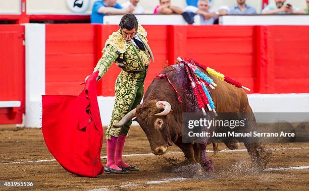 Spanish bullfighter Morante de la Puebla performs during a bullfighting as part of the Feria Santiago in a bullfight on July 25, 2015 in Santander,...