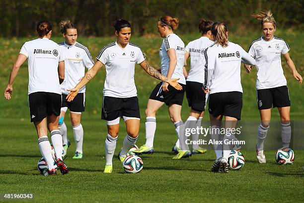 Dzsenifer Marozsan controles the ball during a Germany Women's training session at the Commerzbank Arena training ground on April 2, 2014 in...