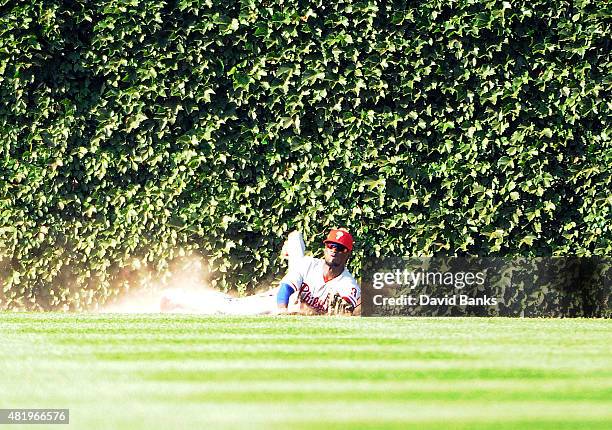 Odubel Herrera of the Philadelphia Phillies makes a catch on Kris Bryant of the Chicago Cubs to save a no hitter during the ninth inning on July 25,...