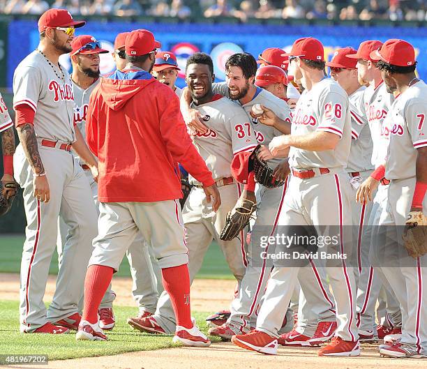 Cole Hamels of the Philadelphia Phillies celebrates his no hitter with his teammates July 25, 2015 at Wrigley Field in Chicago, Illinois. Hamels...