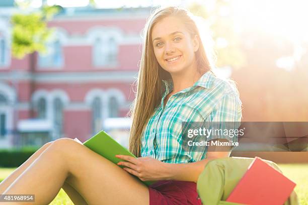 school girl studying in the campus - portrait of school children and female teacher in field stock pictures, royalty-free photos & images
