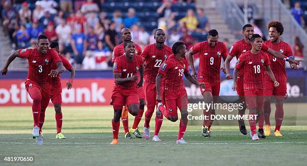 Panama players run to goal keeper Luis Mejia after the shoot out during the 2015 CONCACAF Gold Cup third place match between the USA and Panama July...