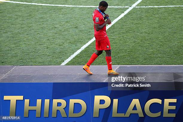 Jaime Penedo of Panama looks at his third place medal after defeating the United States during the CONCACAF Gold Cup Third Place Match at PPL Park on...