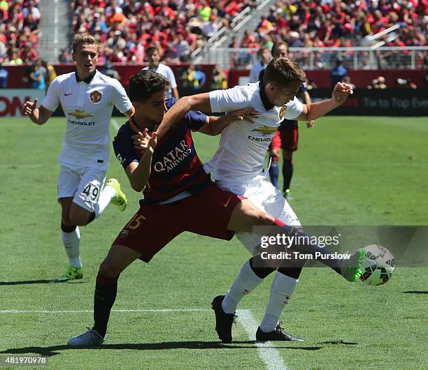 Adnan Januzaj of Manchester United in action with Munir El Haddadi of Barcelona during the International Champions Cup 2015 match between Manchester...