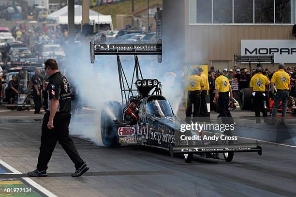 Top Fuel drag racer Antron Brown during his burnout on the second day of qualifying for the Mopar Parts Mile High Nationals at Bandimere Speedway...