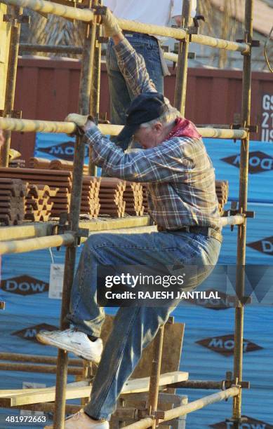 Former seventy-eight year-old American President Jimmy Carter works on the construction site 04 June 2002 , during a blitz construction of 100 houses...