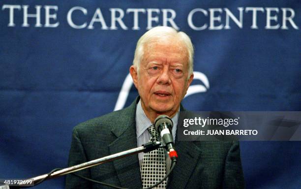 Former US President Jimmy Carter answers questions during a press conference in Caracas, 29 May 2004. Venezuela started, on Friday, a signature check...