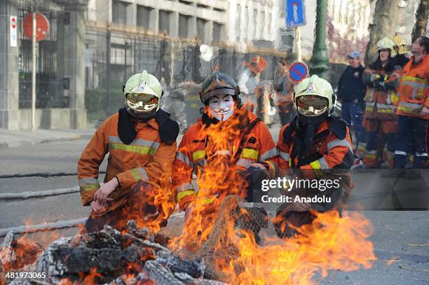Firefighters stage a protest demanding better working conditions, in central Brussels April 2, 2014 in Brussels, Belgium. Around 150 firefighters...