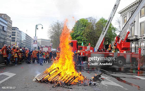 Firefighters stage a protest demanding better working conditions, in central Brussels April 2, 2014 in Brussels, Belgium. Around 150 firefighters...