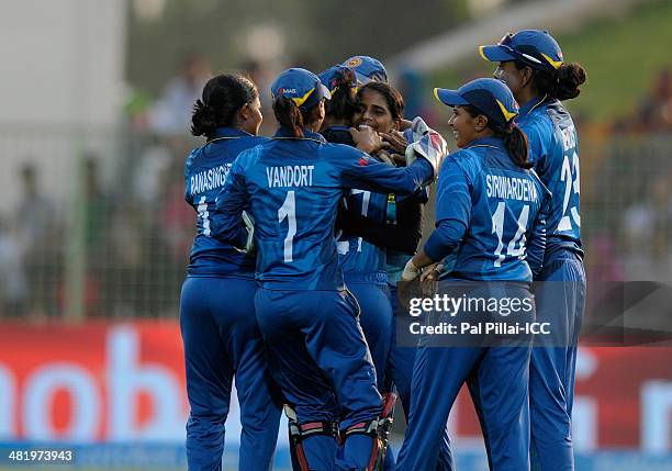 Udeshika Prabodani of Sri Lanka celebrates the wicket of Sophie Devine of New Zealand during the ICC Women's World Twenty20 playoff match 1 between...