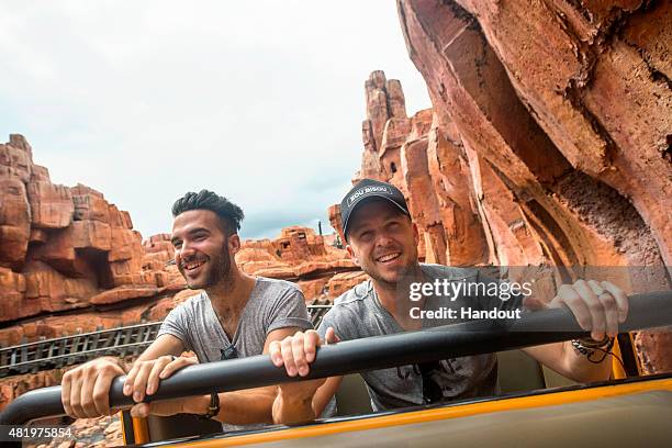 In this handout image provided by Disney Parks, Brian Willett and Ryan Tedder of OneRepublic rock and roll down Big Thunder Mountain at Magic Kingdom...