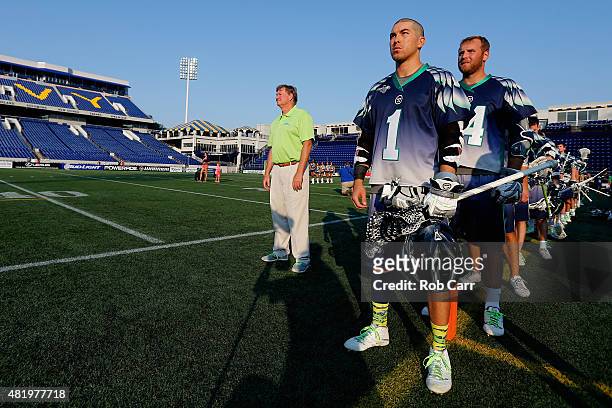 Head coach Dave Cottle and Joe Walters of the Chesapeake Bayhawks listen to the national anthem before the start of their game against the Charlotte...