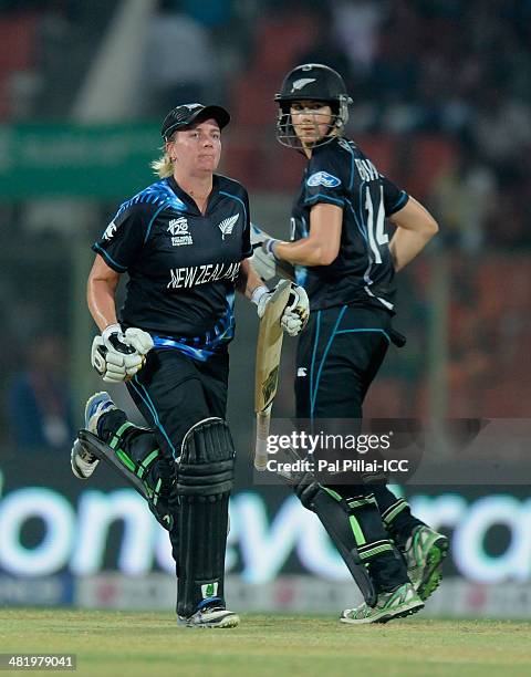 Rachel Priest of New Zealand and Nicola Browne of New Zealand look on as they take the winning run during the ICC Women's World Twenty20 playoff...