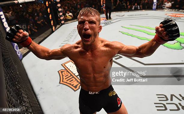 Dillashaw reacts after his TKO victory over Renan Barao of Brazil in their UFC bantamweight championship bout during the UFC event at the United...