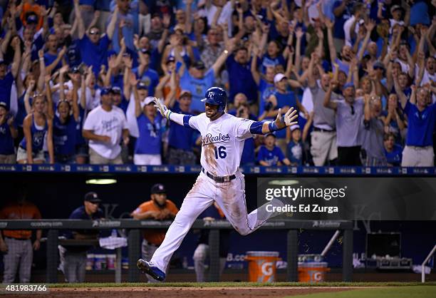 Paulo Orlando of the Kansas City Royals crosses home as he scores the game-winning run in the 10th inning against the Houston Astros at Kauffman...