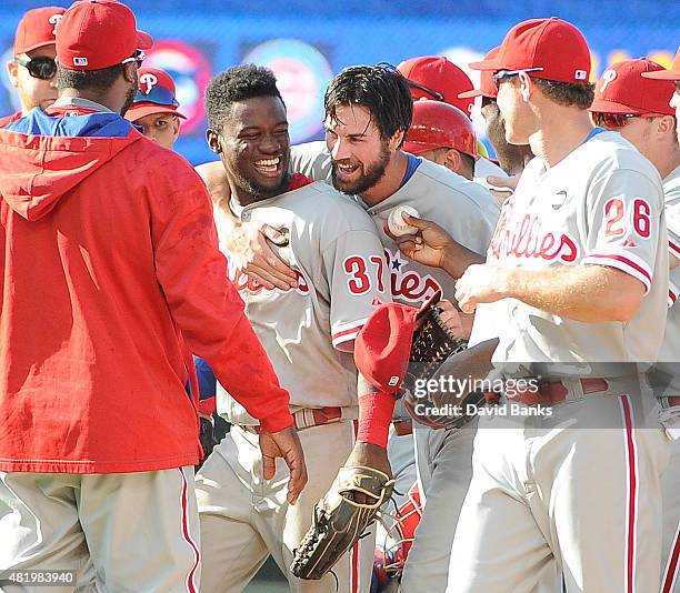 Cole Hamels of the Philadelphia Phillies and Odubel Herrera celebrate on July 25, 2015 at Wrigley Field in Chicago, Illinois. Cole Hamels of the...