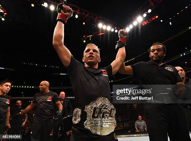 Dillashaw celebrates after his TKO victory over Renan Barao of Brazil in their UFC bantamweight championship bout during the UFC event at the United...