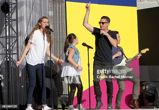 Bree Bogucki, Madison Tevlin, and Marc Roberge of O.A.R open the 2015 Los Angeles Special Olympics World Games by performing the Coca-Cola Unified...