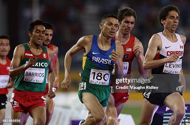 Altobeli Da Silva of Brazil and Cameron Levins of Canada lead the Men's 5000m Final during Day 15 of the Toronto 2015 Pan Am Games at the Pan Am...