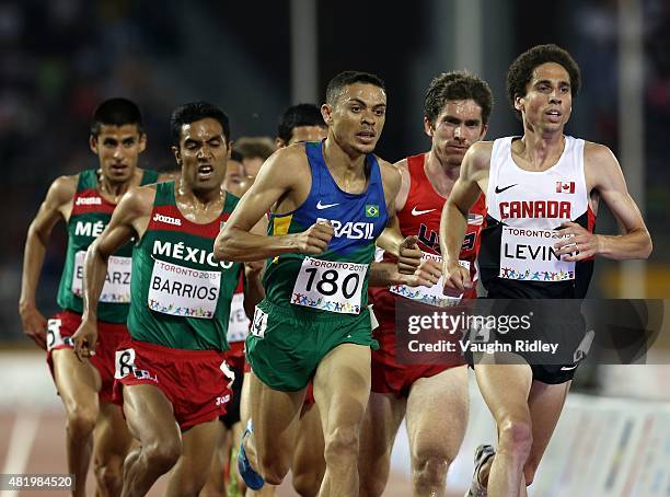 Altobeli Da Silva of Brazil and Cameron Levins of Canada lead the Men's 5000m Final during Day 15 of the Toronto 2015 Pan Am Games at the Pan Am...