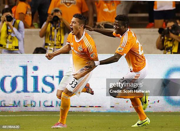 Leonel Miranda and Rasheed Olabiyi of the Houston Dynamo celebrate after Miranda scored a second half goal against the Los Angeles Galaxy at BBVA...