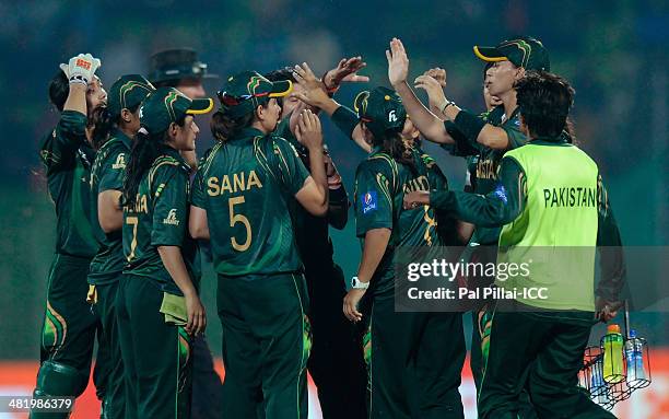 Sania Iqbal of Pakistan celebrates the wicket of Smriti Mandana of India during the ICC Women's World Twenty20 Playoff 2 match between Pakistan Women...