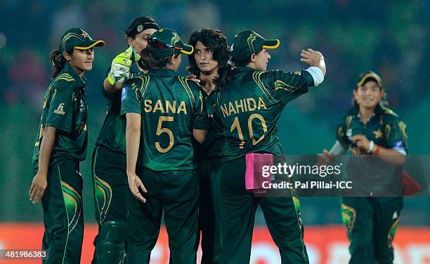 Sania Iqbal of Pakistan celebrates the wicket of Smriti Mandana of India during the ICC Women's World Twenty20 Playoff 2 match between Pakistan Women...