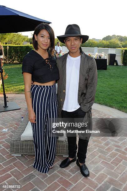 May Kwok and Michael Mente attend The REVOLVE Hamptons House on July 25, 2015 in Sagaponack, New York.