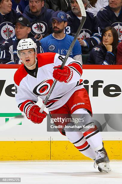 Andrei Loktionov of the Carolina Hurricanes keeps an eye on the play during first period action against the Winnipeg Jets at the MTS Centre on March...