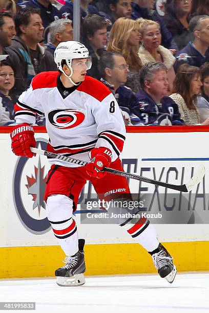 Andrei Loktionov of the Carolina Hurricanes keeps an eye on the play during first period action against the Winnipeg Jets at the MTS Centre on March...