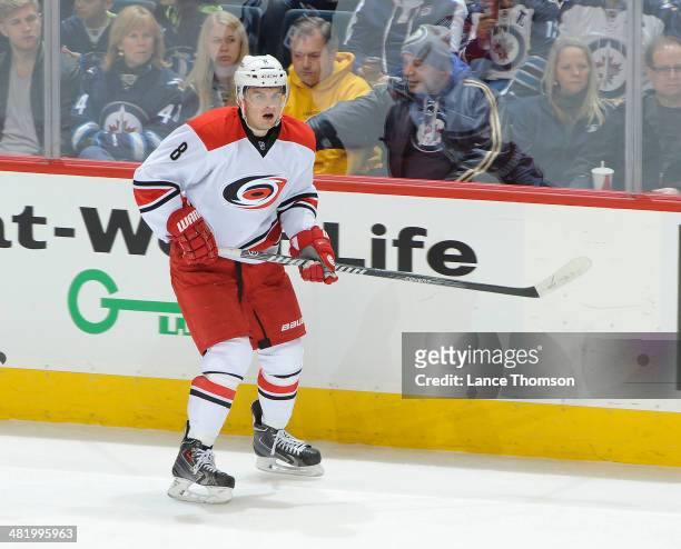 Andrei Loktionov of the Carolina Hurricanes keeps an eye on the play during second period action against the Winnipeg Jets at the MTS Centre on March...