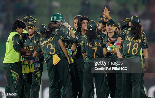 Sania Khan of Pakistan celebrates the wicket of Punam Raut of India during the ICC Women's World Twenty20 Playoff 2 match between Pakistan Women and...