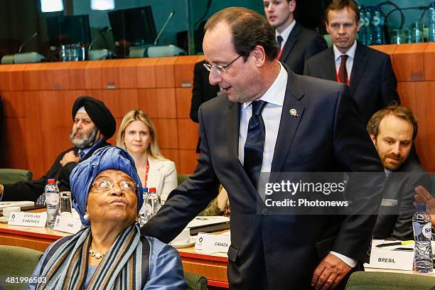 Liberia President Ellen Johnson Sirleaf and French President Francois Hollande attend the first day of the summit of European Union and African heads...