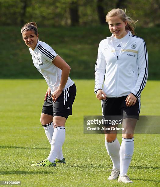 Lena Lotzen and Tabea Kemme attend a Germany Women's training session at the Commerzbank Arena training ground on April 2, 2014 in Frankfurt am Main,...