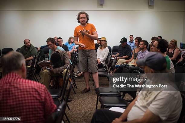 Patrick St. John speaks during a meeting of the Burlington chapter of the International Socialist Organization as they discuss if they should support...