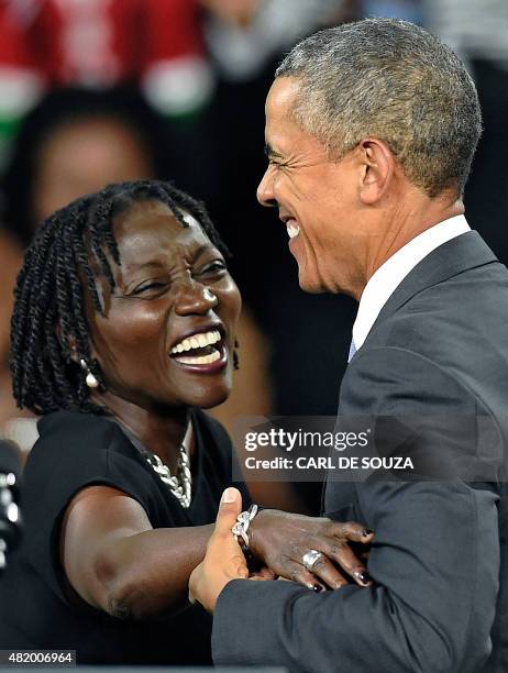 President Barack Obama embraces his sister Auma at the Moi International Sports centre in Nairobi on July 26, 2015. Obama arrived on July 24 in the...