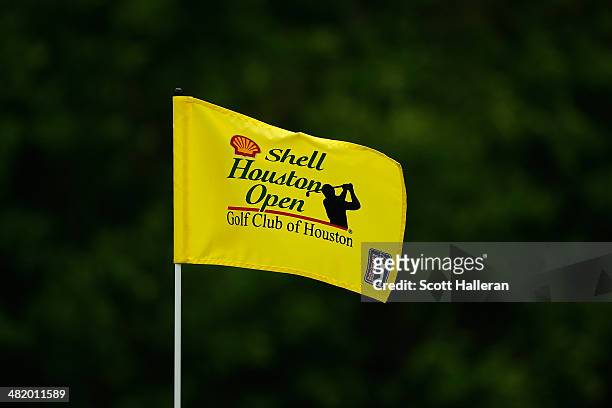Flag with the Shell Houston Open Logo flaps in the wind on a green during the pro-am prior to the start of the Shell Houston Open at the Golf Club of...