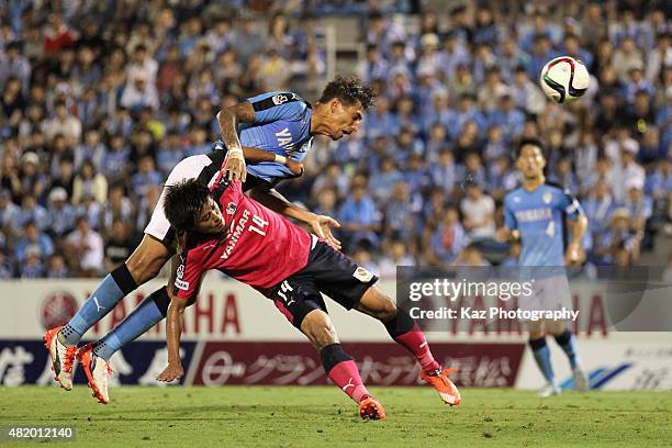 Jay Bothroyd of Jubilo Iwata and Yusuke Maruhashi of Cerezo Osaka compete for the ball during the J.League second division match between Jubilo Iwata...