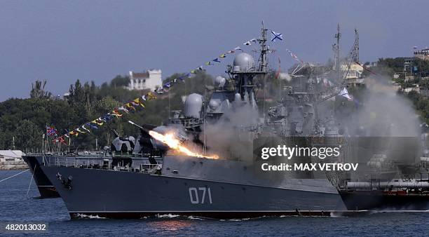 Russian Navy ship fires missiles during Navy Day celebrations in the Crimean city of Sevastopol on July 26, 2015. AFP PHOTO / MAX VETROV