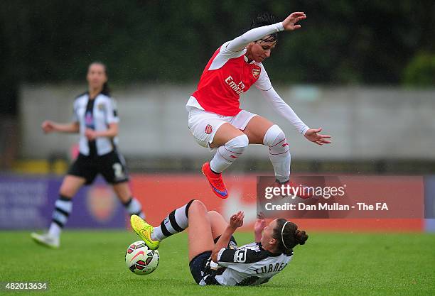 Marta Corredera of Arsenal leaps over the tackle of Amy Turner of Notts County during the WSL match between Arsenal Ladies and Notts County Ladies at...