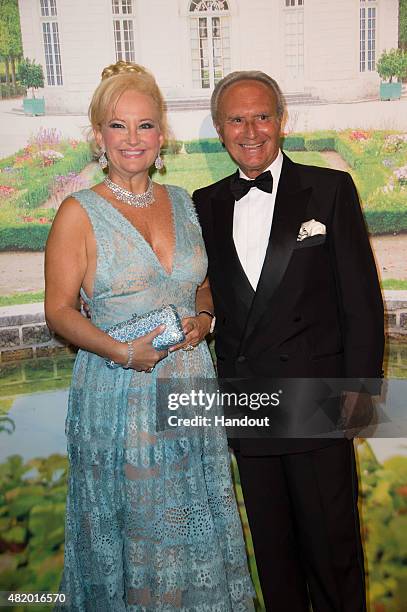 In this handout provided by Le Palais Princier, Marquess Roberta Gilardi and Dottore Donato Sestito pose during the Monaco Red Cross Gala on July 25,...