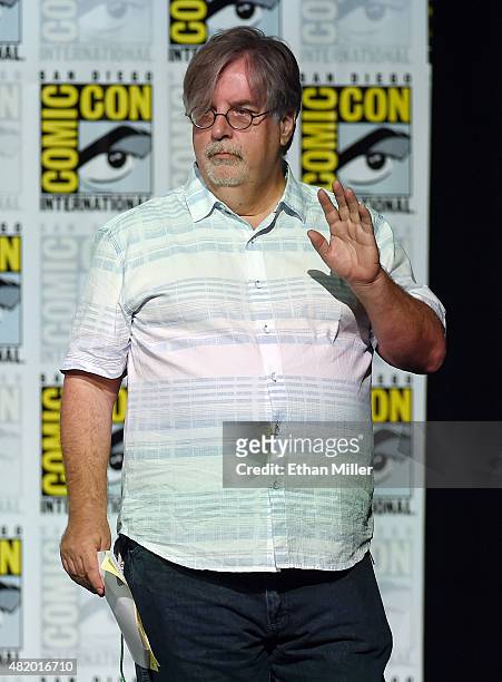 Producer/writer Matt Groening waves as he arrives at "The Simpsons" panel during Comic-Con International 2015 at the San Diego Convention Center on...