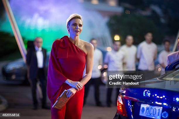 In this handout provided by Le Palais Princier, Princess Charlene of Monaco arrives at the Monaco Red Cross Gala on July 25, 2015 in Monte-Carlo,...