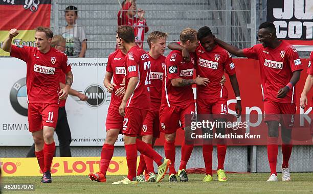 Sven Michel of Cottbus jubilates with team mates after scoring the second goal during the third league match between FC Energie Cottbus and...