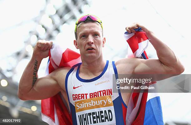 Richard Whitehead of Great Britain celebrates winning the Men's 200m T42 race during day three of the Sainsbury's Anniversary Games at The Stadium -...