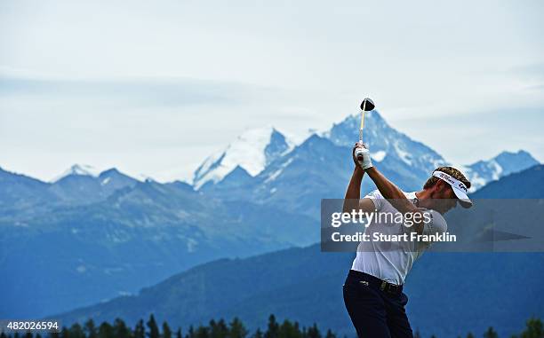 Raphael Jacquelin of France plays a shot during the final round of the Omega European Masters at Crans-sur-Sierre Golf Club on July 26, 2015 in...