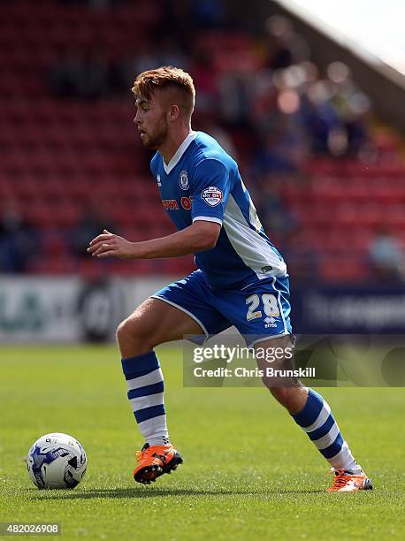 Callum Camps of Rochdale in action during the pre season friendly match between Rochdale and Huddersfield Town at Spotland on July 18, 2015 in...
