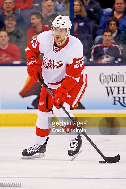 Brian Lashoff of the Detroit Red Wings controls the puck during the game against the Columbus Blue Jackets on March 25, 2014 at Nationwide Arena in...